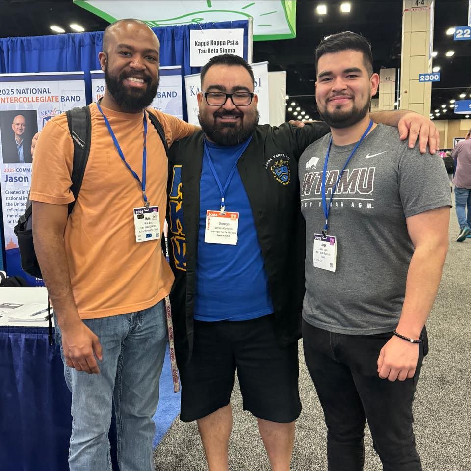 Three Alpha Psi alumni together at a convention